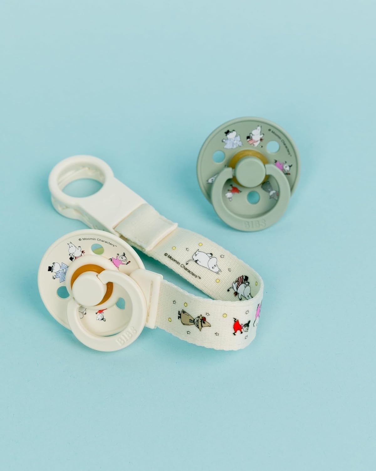 image:imageBIBS Loop Pacifier Clip Sleek Secure OneHanded Operation Fits All BIBS and Most Brands Machine Washable Slim Profile for Comfort Ages 0 Dark OakIvory Moomin